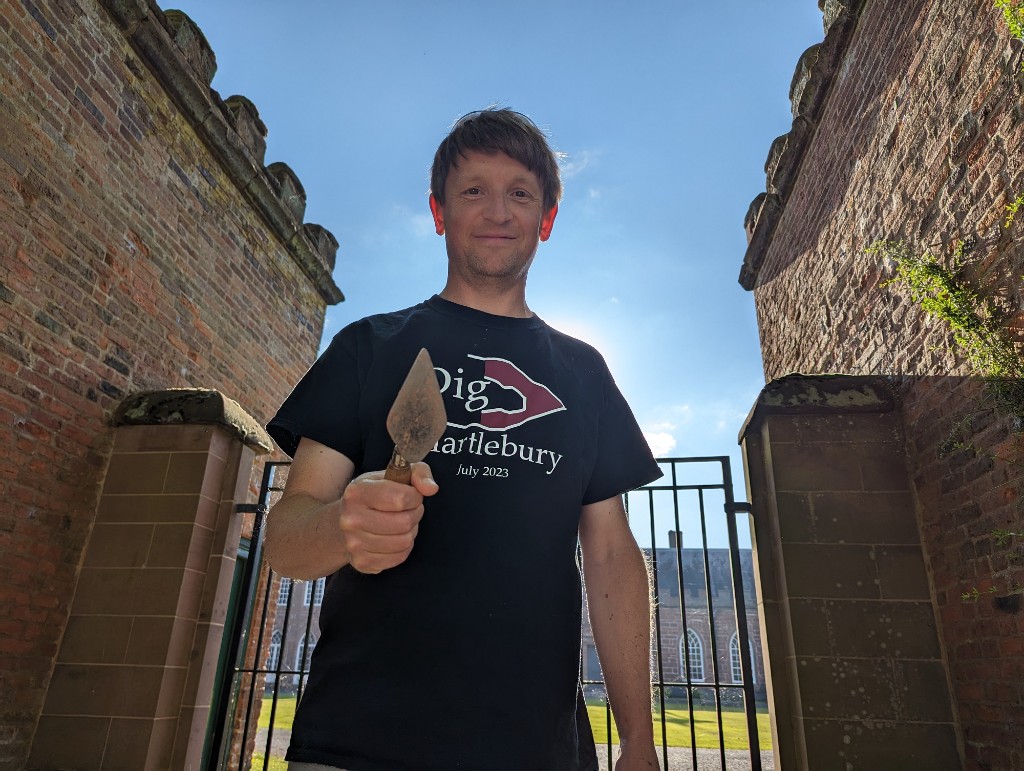 A man holding a trowel