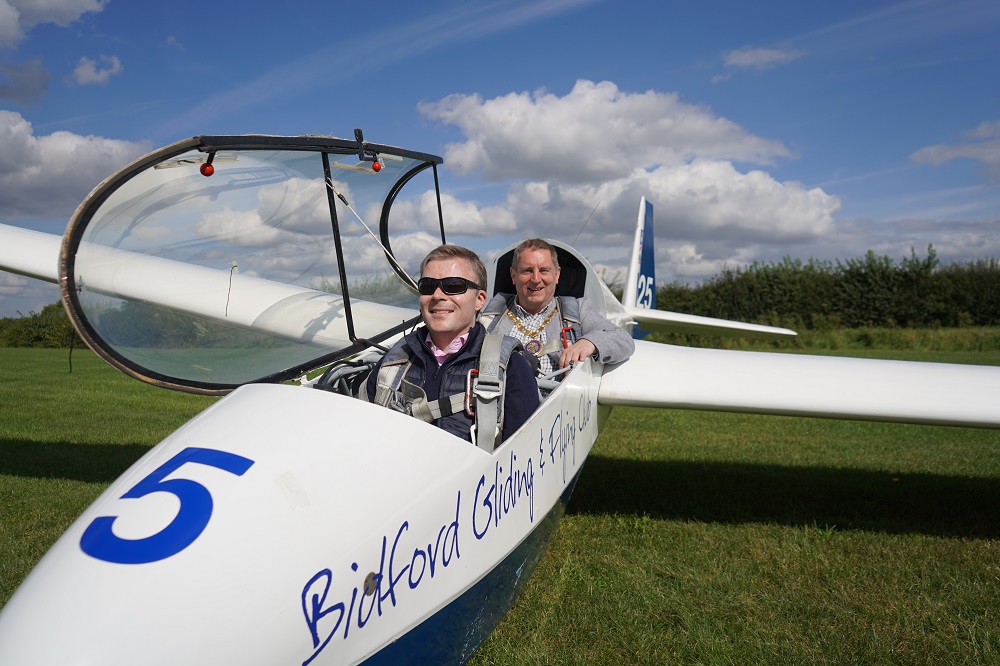 Cllr Thomas and Cllr Raphael sat in a glider