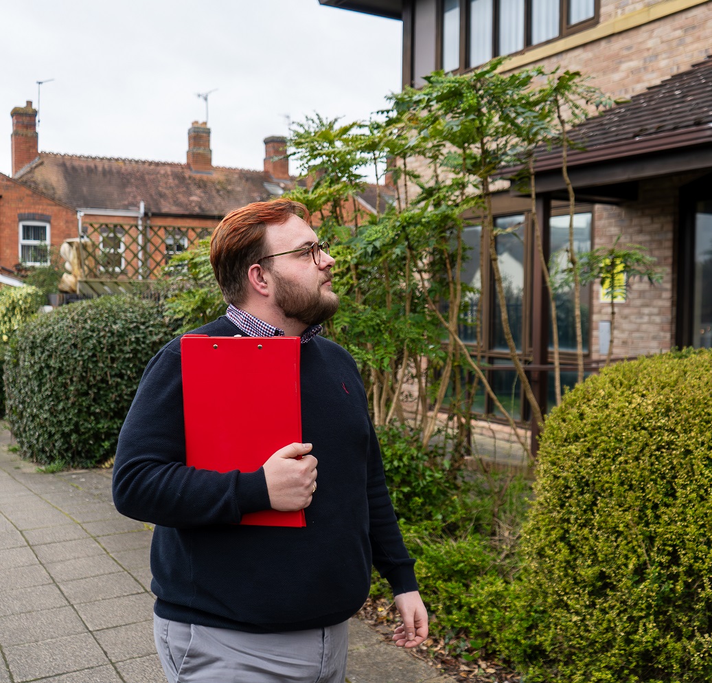 A woman hugging a tree.
