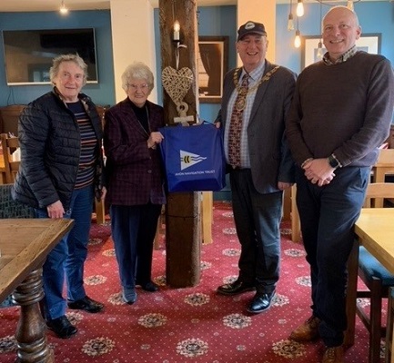 A group of people stood in a line.