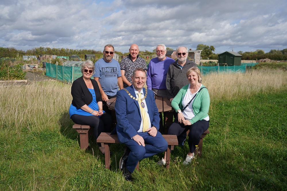 A group of people sat on a bench