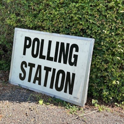 A picture of a polling station sign